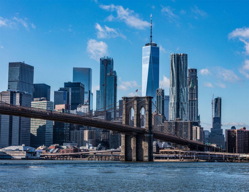 A photo of Lower Manhattan with the Brooklyn Bridge featured.