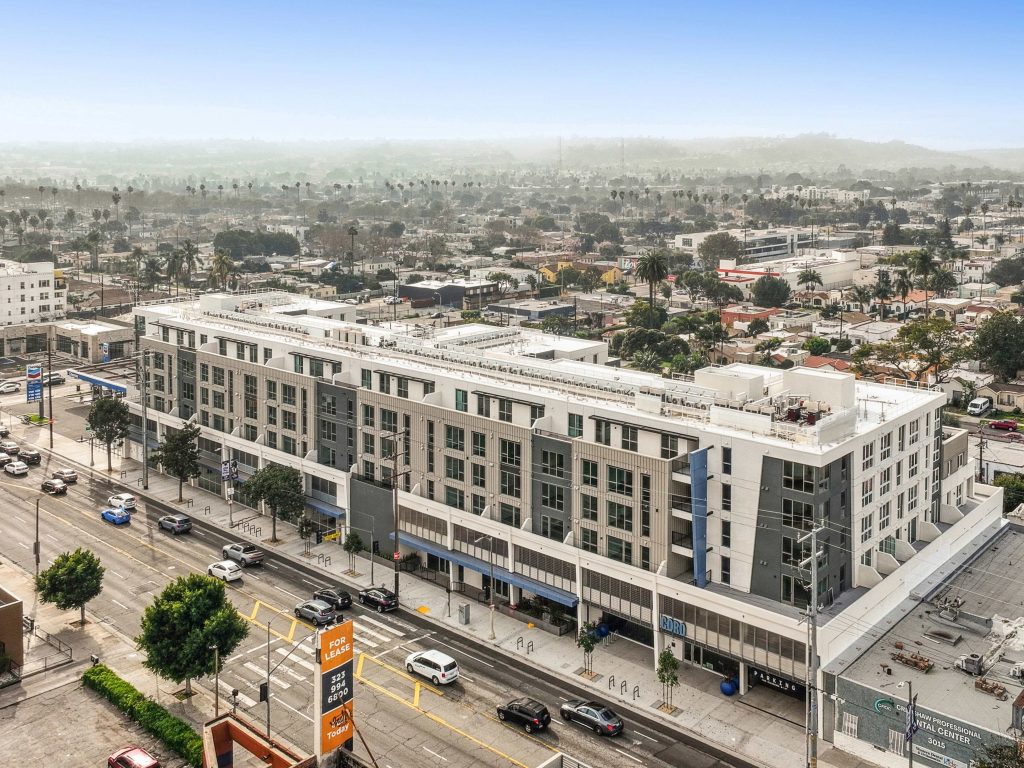Outside shot of Coro, a 168-unit one-building community in the neighborhood of West Adams, Los Angeles.