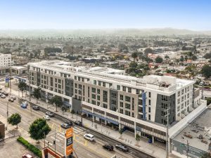 Outside shot of Coro, a 168-unit one-building community in the neighbourhood of West Adams, Los Angeles.