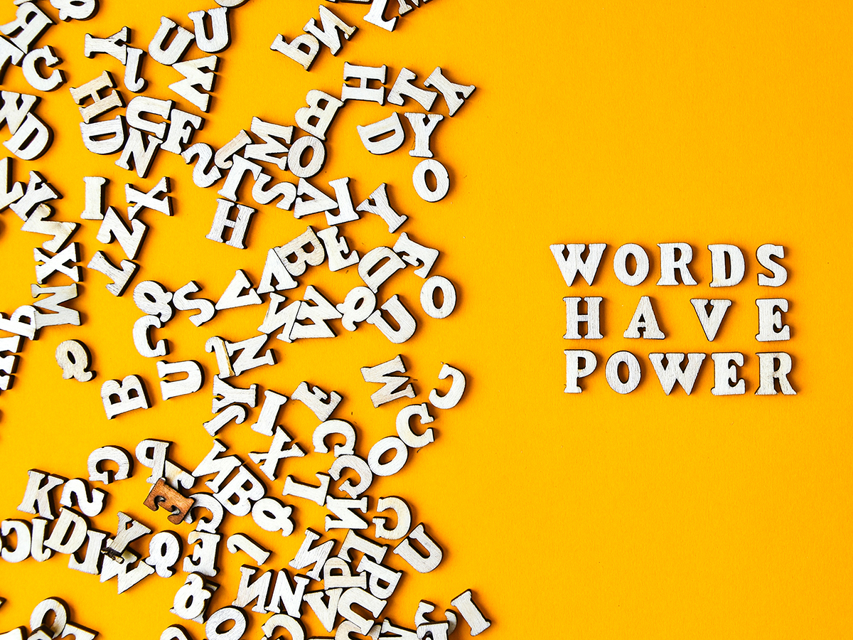 Quote WORDS HAVE POWER made out of wooden letters on bright yellow background. Motivational Words Quotes Concept