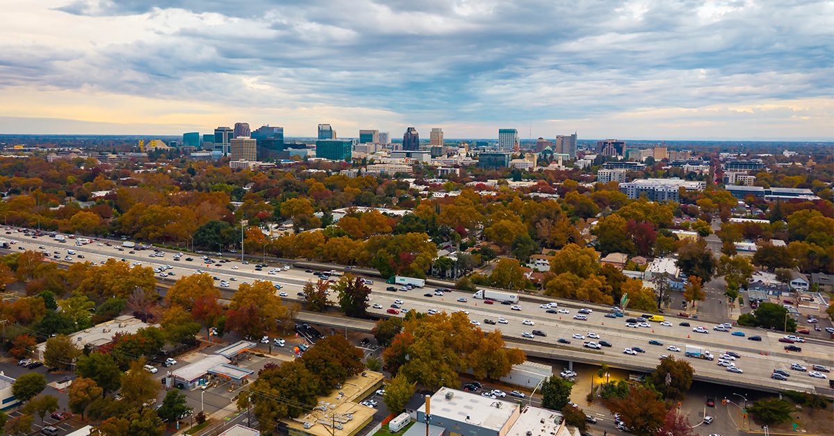 Sacramento, CA, USA - November 12, 2025: Wide aerial panoramic view of modern skyscrapers and business district buildings in downtown Sacramento.
