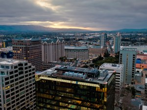 Aerial shot of San Jose, California at sunrise on a cloudy morning. Authorization was obtained from the FAA for this operation in restricted airspace.