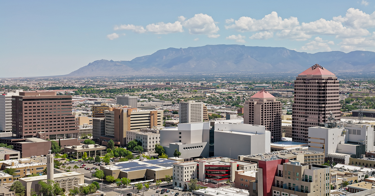 Aerial shot of downtown Albuquerque, New Mexico, with Sandia Crest visible in the distance, on a sunny day. 
* Authorization was obtained from the FAA for this operation in restricted airspace.