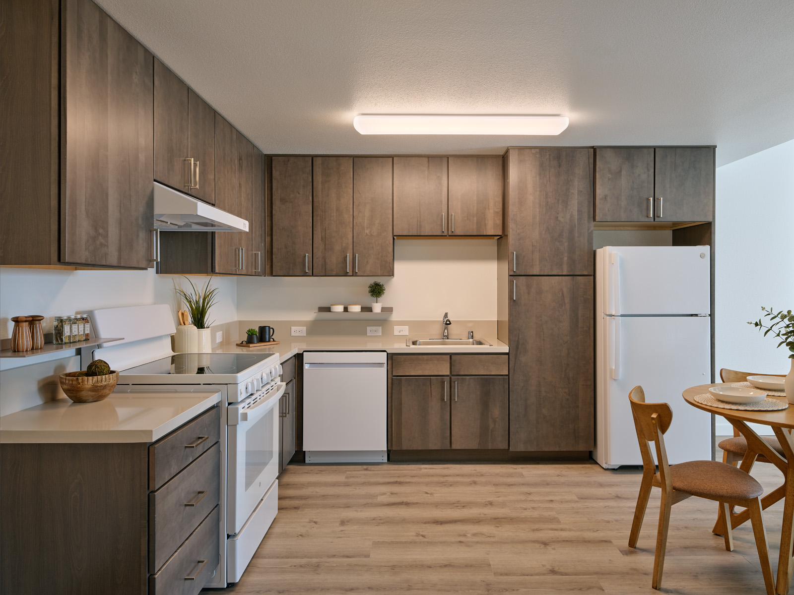 Units feature upgraded finishes, including stone countertops and durable flooring, designed to align with market-rate housing standards.