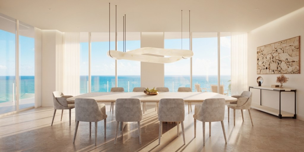 Luxurious oceanfront dining room with floor-to-ceiling windows, modern furniture, and a stunning ocean view. Bright, airy, and serene atmosphere.