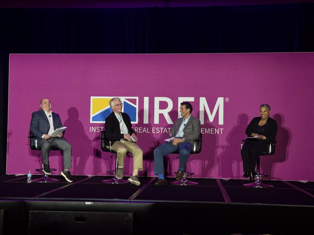 A photo of a panel at PropertyCon.