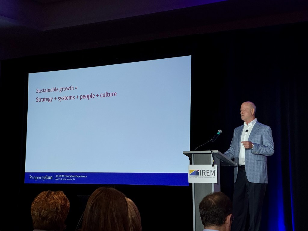 A photo of Sunrise Management CEO Joe Greenblatt giving a talk at PropertyCon.