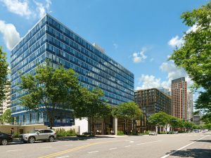 A rendering of 2200 Crystal Drive, a former office building in National Landing in Northern Virginia that is being transformed by JBG SMITH into 195 multifamily units. It is the firm's most recent office-to-residential conversion in the region, where it has completed more than 1,500 units of conversions.