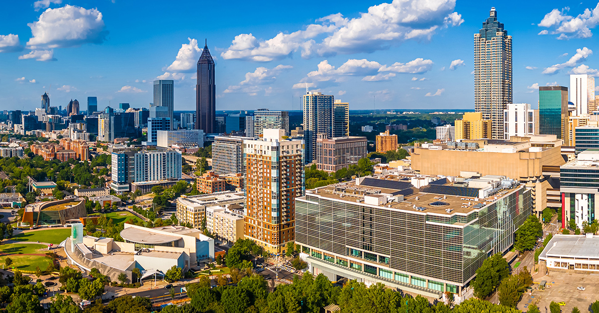Atlanta Skyline with Midtown Towers Above Lush Urban Park in Summer Light