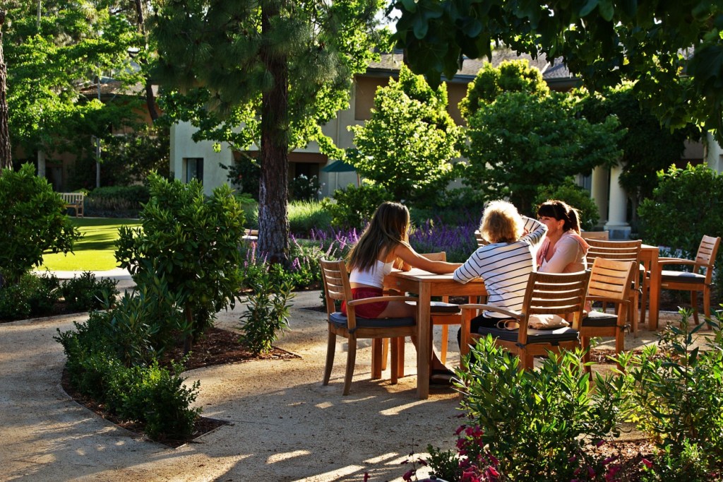 view of residents sitting at a table at Vista del Monte senior living
