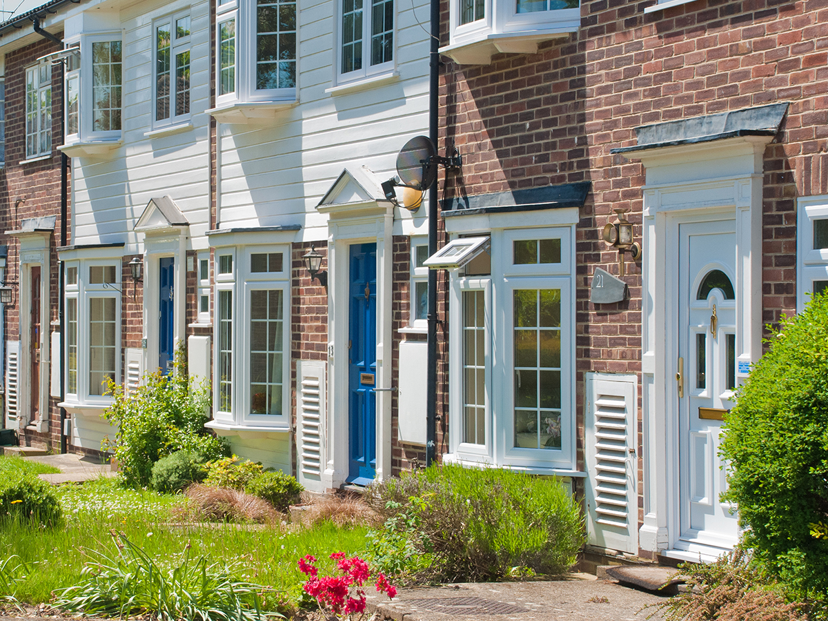 Exterior shot depicting a row of duplex homes.