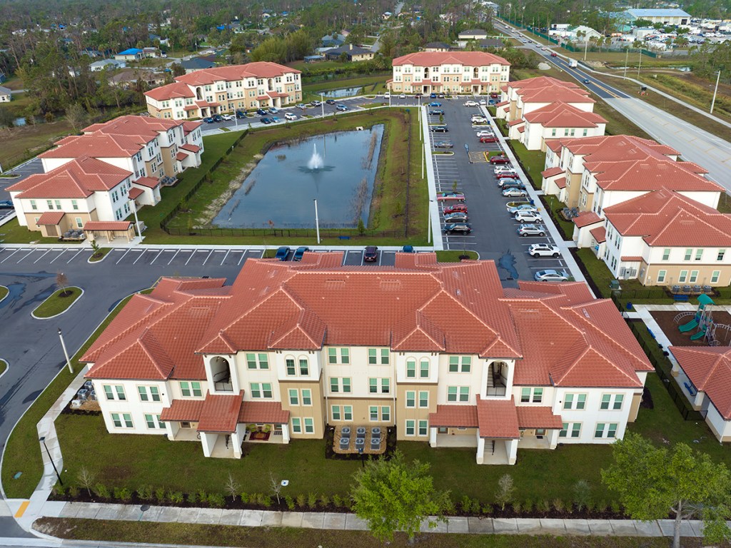 Aerial view of american apartment buildings in Florida residential area. New family condos as example of housing development in US suburbs.
