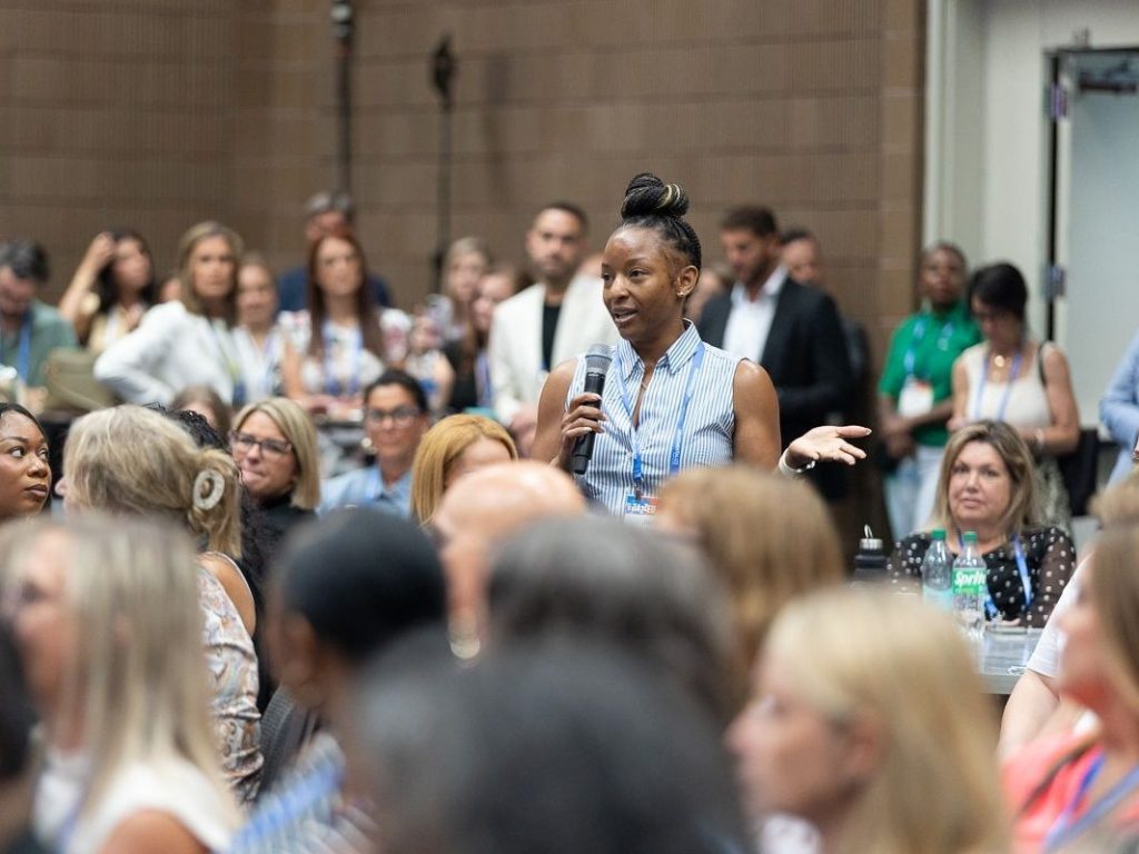An attendee asks a question during a session at Apartmentalize.