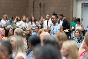 An attendee asks a question during a session at Apartmentalize.