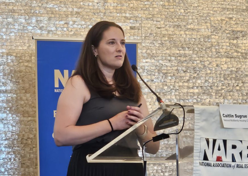 Caitlin Sugrue Walter, Ph.D., senior vice president & head of research and innovation at the National Multifamily Housing Council, presents at NAREE's 2026 real estate journalism conference. Photo by Suzann D. Silverman