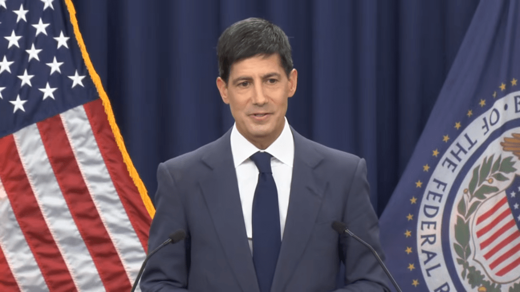 A photo of Kevin Warsh speaking at the press conference following the June 17 announcement