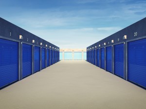 Outdoor self storage units with blue doors.