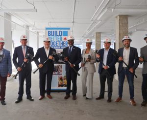 Skender officials at 500 N. Michigan Ave. in Chicago, were work began to convert the office building into a residential community.