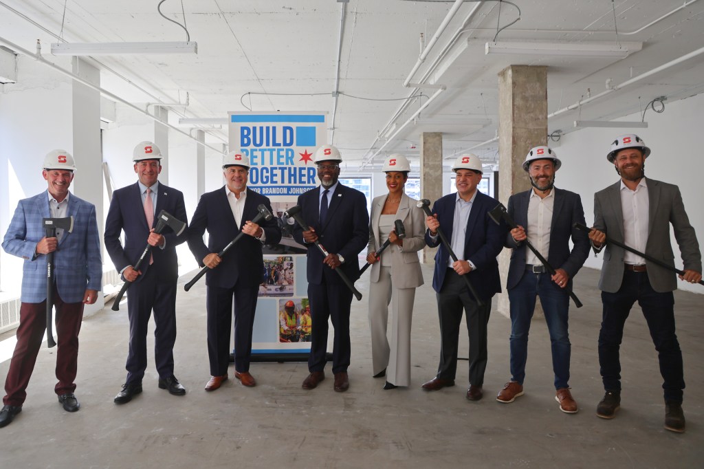 Skender officials at 500 N. Michigan Ave. in Chicago, were work began to convert the office building into a residential community.