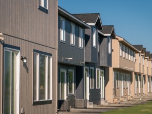 Exterior shot depicting a row of townhome units.