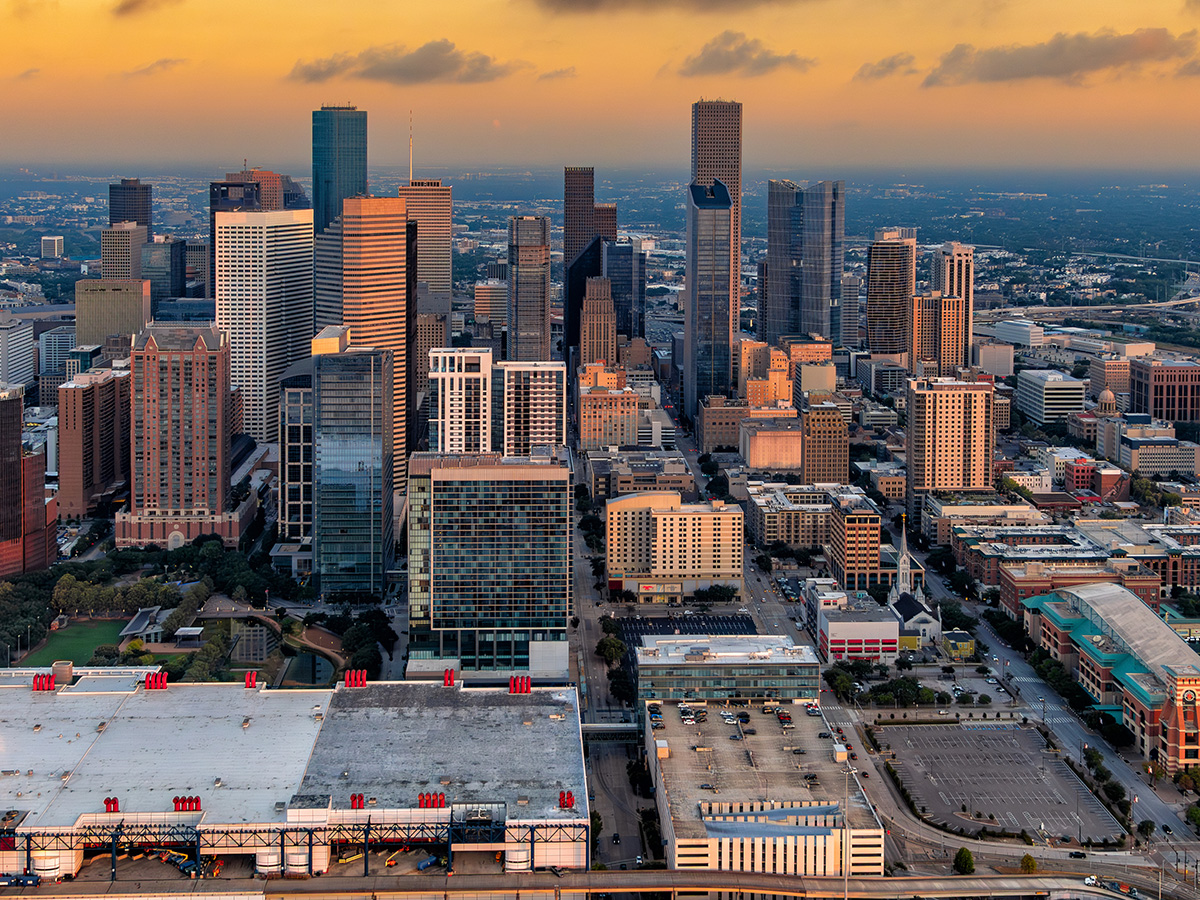 The beautiful city of Houston, Texas shot via helicopter from an altitude of about 1500 feet along the east side of downtown at dawn.