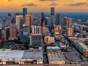 The beautiful city of Houston, Texas shot via helicopter from an altitude of about 1500 feet along the east side of downtown at dawn.