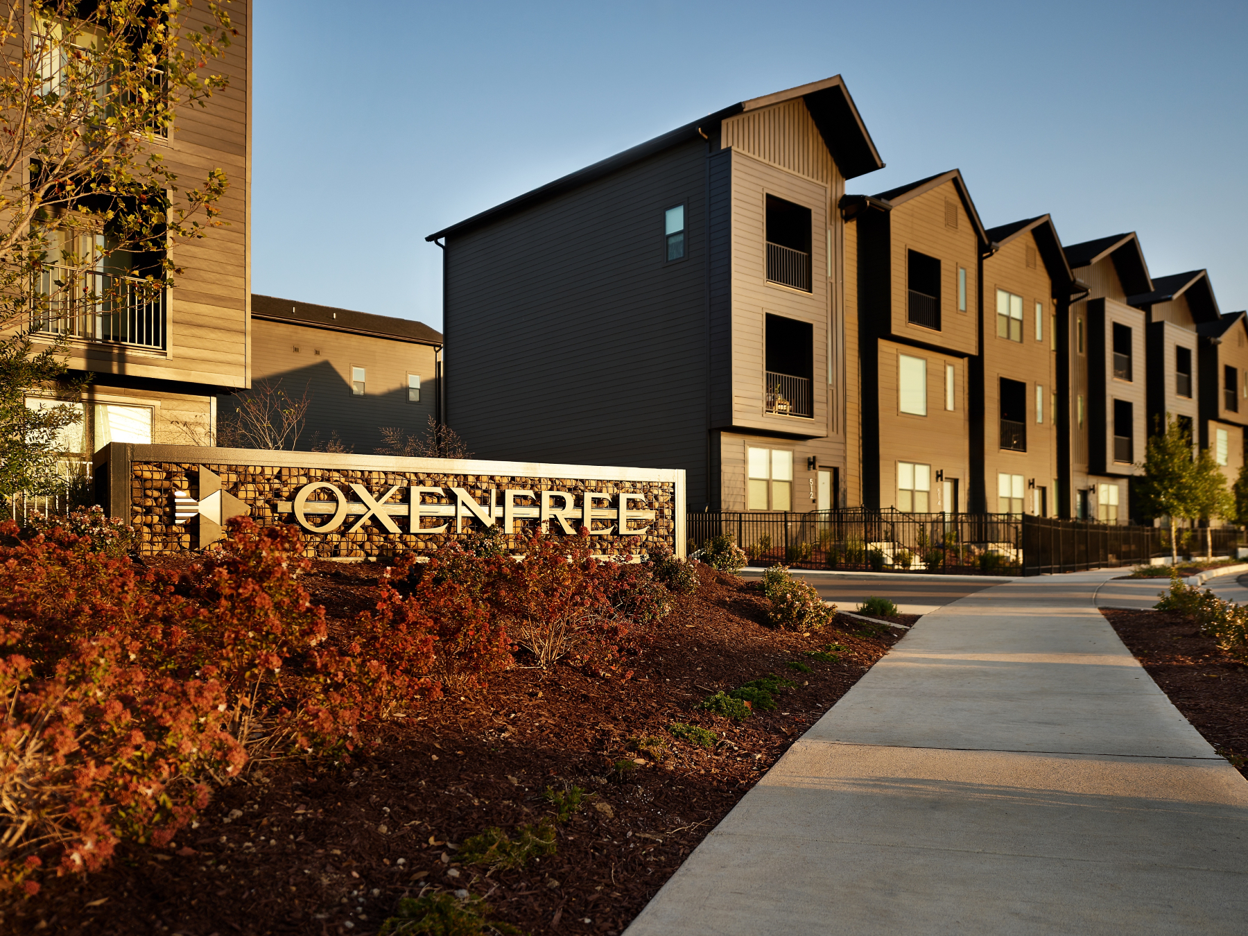 Exterior image featuring the townhomes of an Onxenfree-branded BTR property.