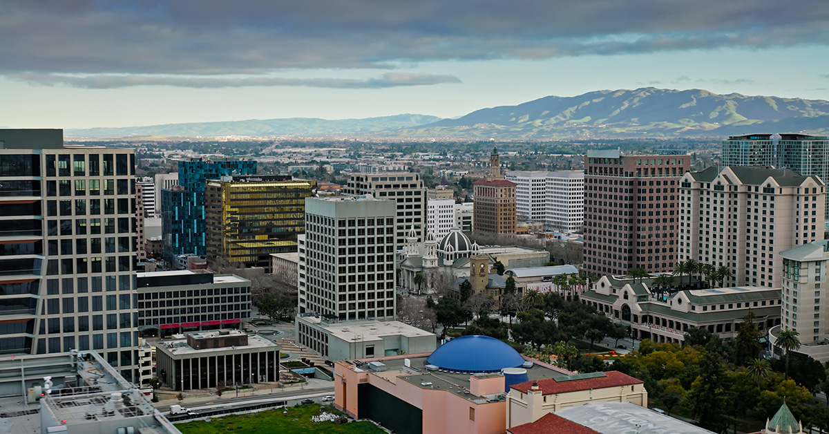 Aerial shot of San Jose, California at sunrise on a cloudy morning. 
Authorization was obtained from the FAA for this operation in restricted airspace.
