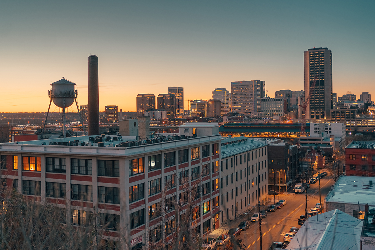 A photograph of American Tobacco Center, which consists of several apartment buildings in an urban block in Richmond. 