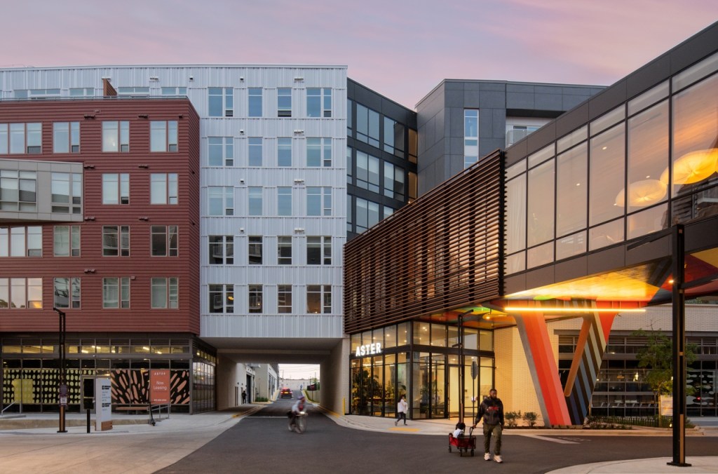 buildings at dusk with art around