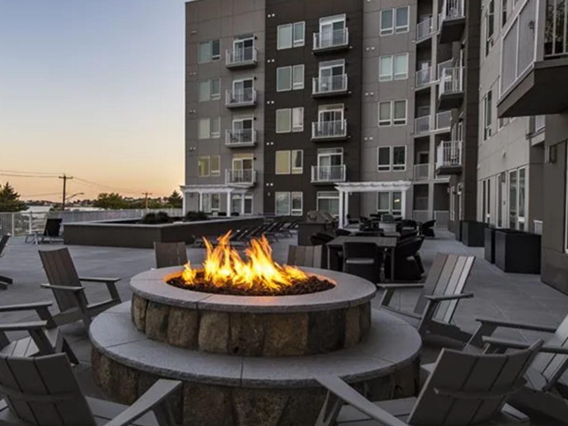 Exterior shot of the deck at Elion on Ocean, featuring open-air fireplaces.