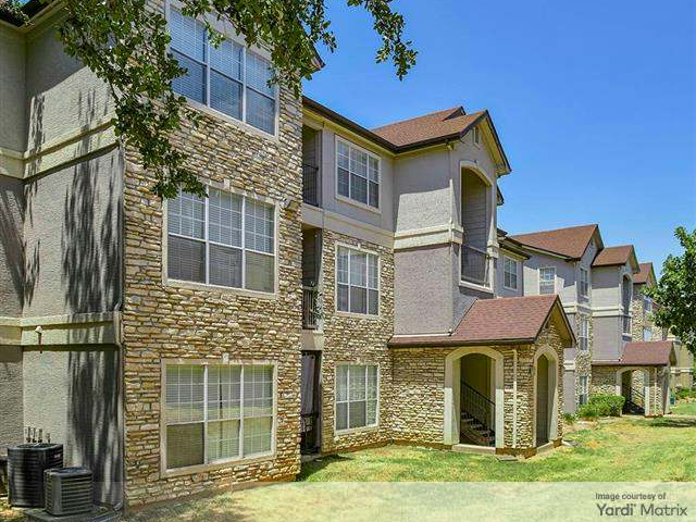 Exterior shot depicting one of the 25 multifamily buildings that make up Beck at Wells Branch, a property in Austin, Texas.