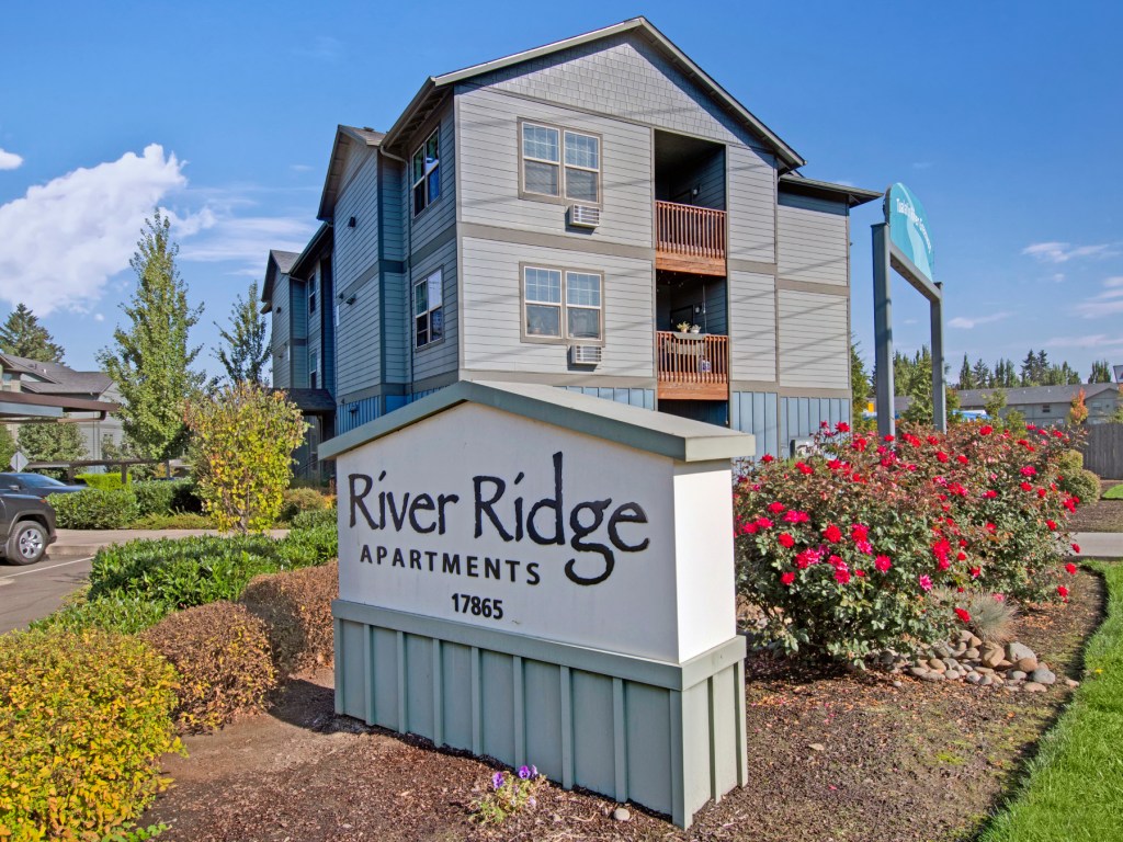 Exterior shot featuring one of the buildings that makes up River Ridge and the community's signage in Tualatin, Ore.