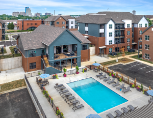Aerial view of student housing community with pool