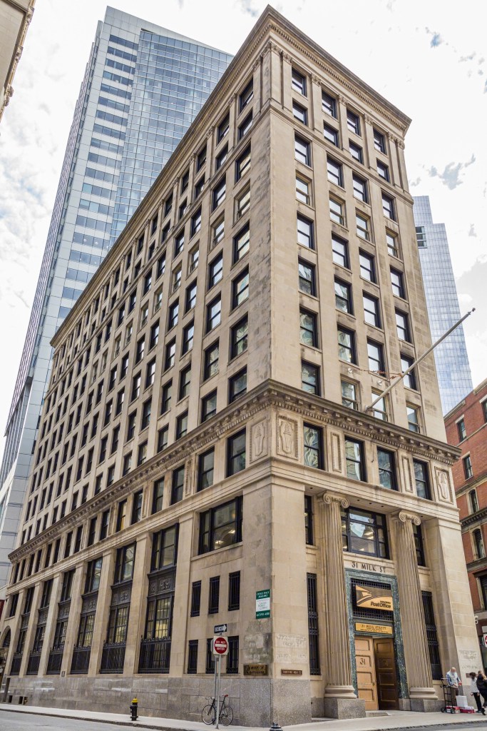 a photo of 31 Milk St. in Boston's Financial District, which is being converted from an office building to 110 units of housing, including 22 affordable units. Developers of the adaptive reuse project, Dinosaur Capital Partners and Mugar Enterprises, secured million in construction financing in a deal arranged by JLL Capital Markets.