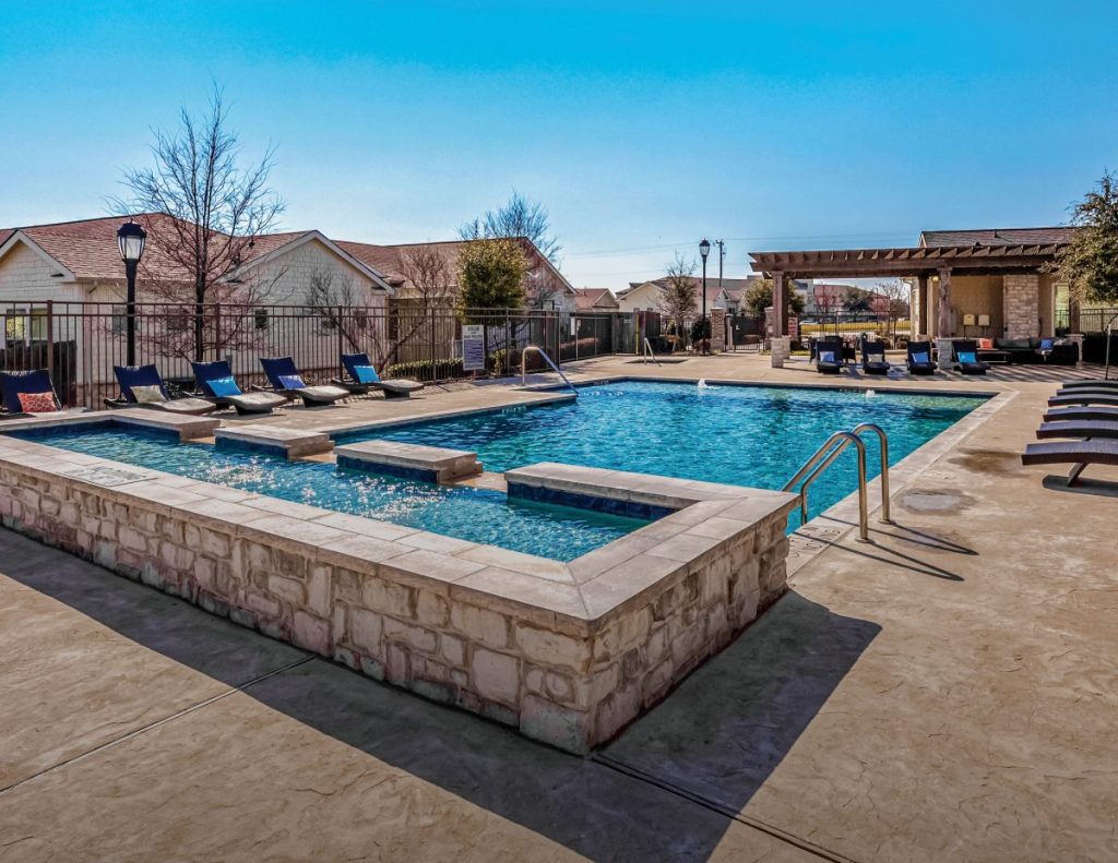 Exterior shot featuring the swimming pool of Horizon at Premier, a build-to-rent property in Plano, Texas, that Invesco acquired from Starboard.