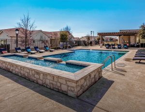 Exterior shot featuring the swimming pool of Horizon at Premier, a build-to-rent property in Plano, Texas, that Invesco acquired from Starboard.
