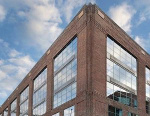A photo of the former office building at 3333 K St. NW in Washington, D.C.'s Georgetown neighborhood that is being converted more than 20 luxury condominiums and retail space by ONE Street Commercial Development.