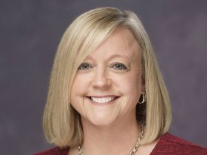 headshot of Angie Loew, vice president & CFO of Breeden Construction
