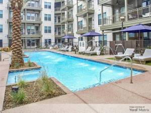 Exterior shot featuring one of the two swimming pools included in The Alyssa, a multifamily property in Tempe, Ariz.
