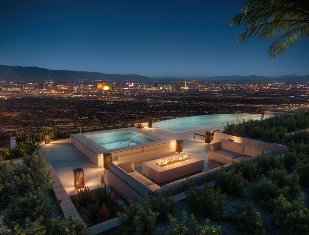 Infinity pool and fire pit at night