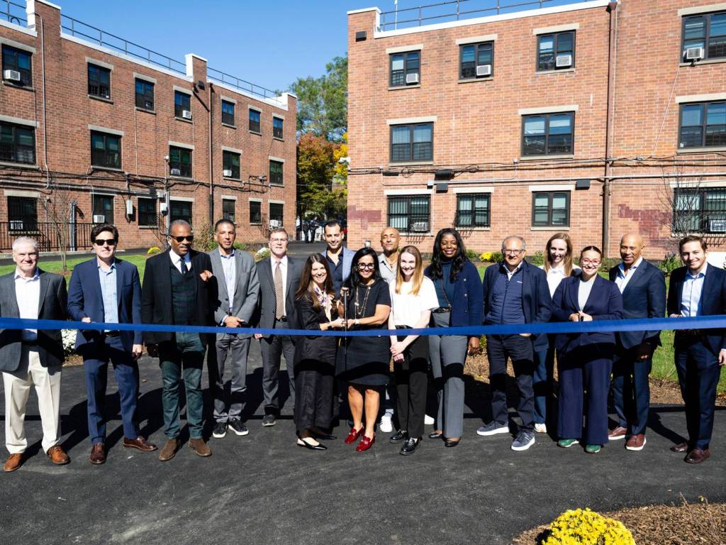 Exterior shot depicting the ribbon cutting ceremony for Reid & Park Rock's renovation completion in Brooklyn, N.Y.
