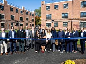 Exterior shot depicting the ribbon cutting ceremony for Reid & Park Rock's renovation completion in Brooklyn, N.Y.