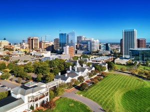Downtown Richmond skyline aerial with a classic looking colonial revival building in the foreground, during autumn.