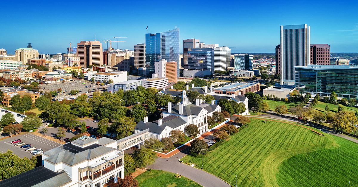 Downtown Richmond skyline aerial with a classic looking colonial revival building in the foreground, during autumn.