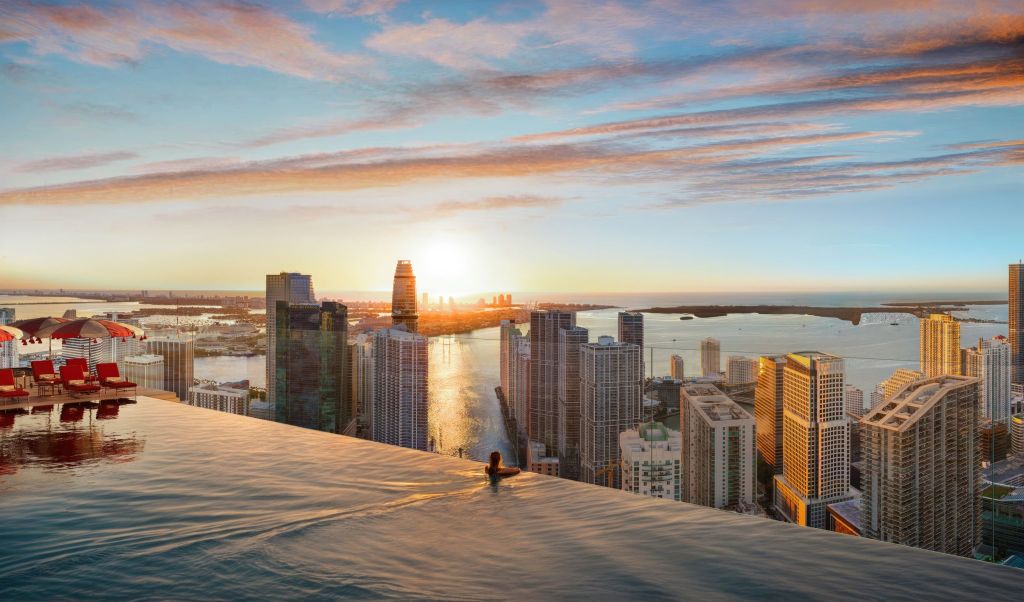 Rendering of an infinity-edge swimming pool with views of Miami, part of Faena Residences Miami condo project.